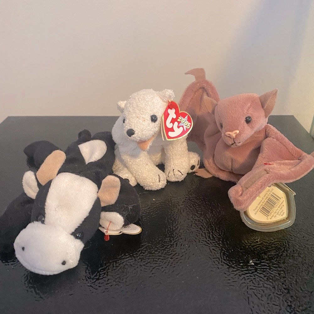 Beanie Babies. Daisy the Cow, Aurora the Polar Bear, and Batty the Bat.